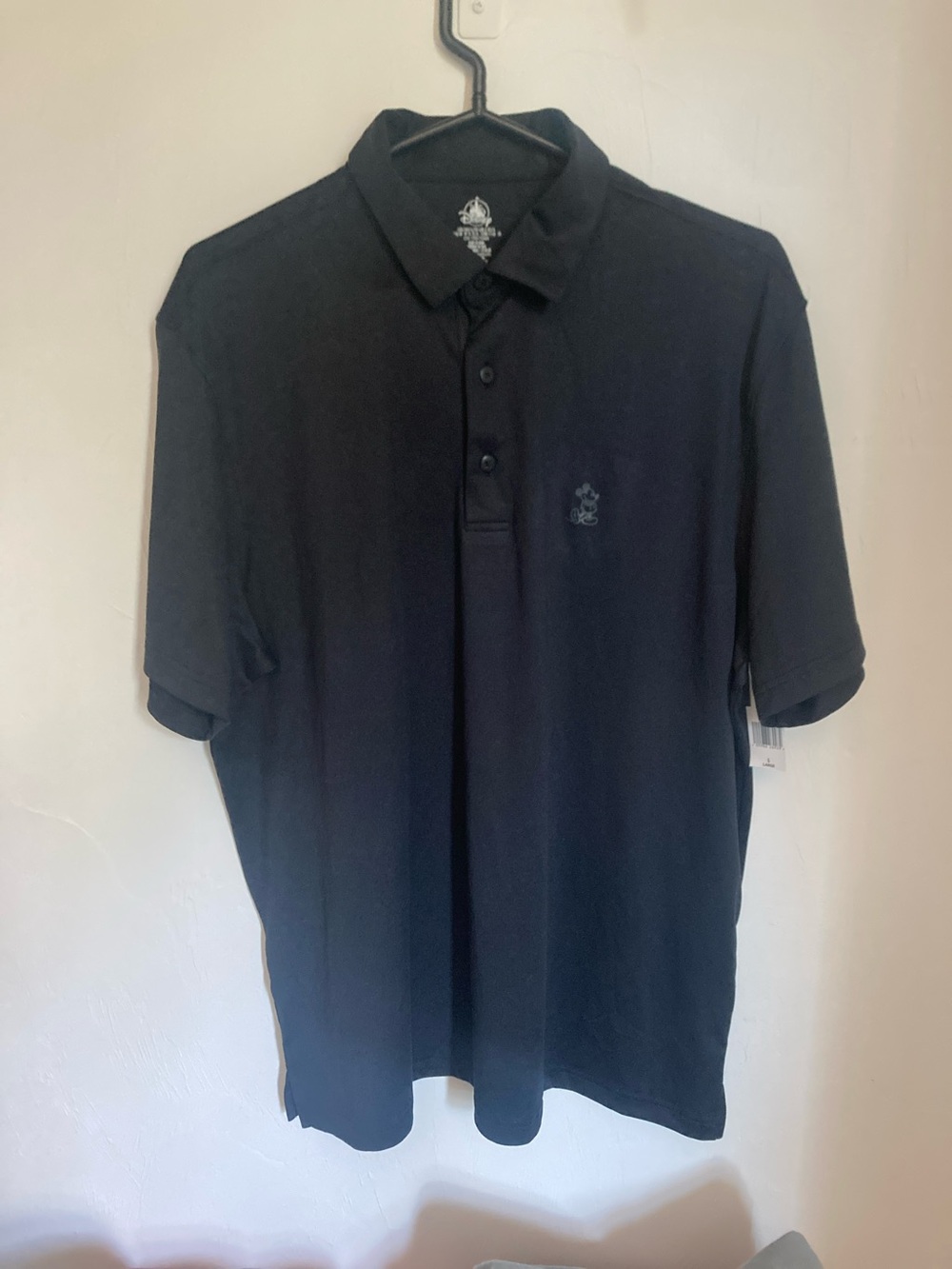 Disney Men's Black Polo Shirt with Subtle Logo